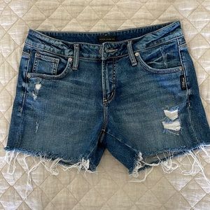 Silver distressed jean shorts